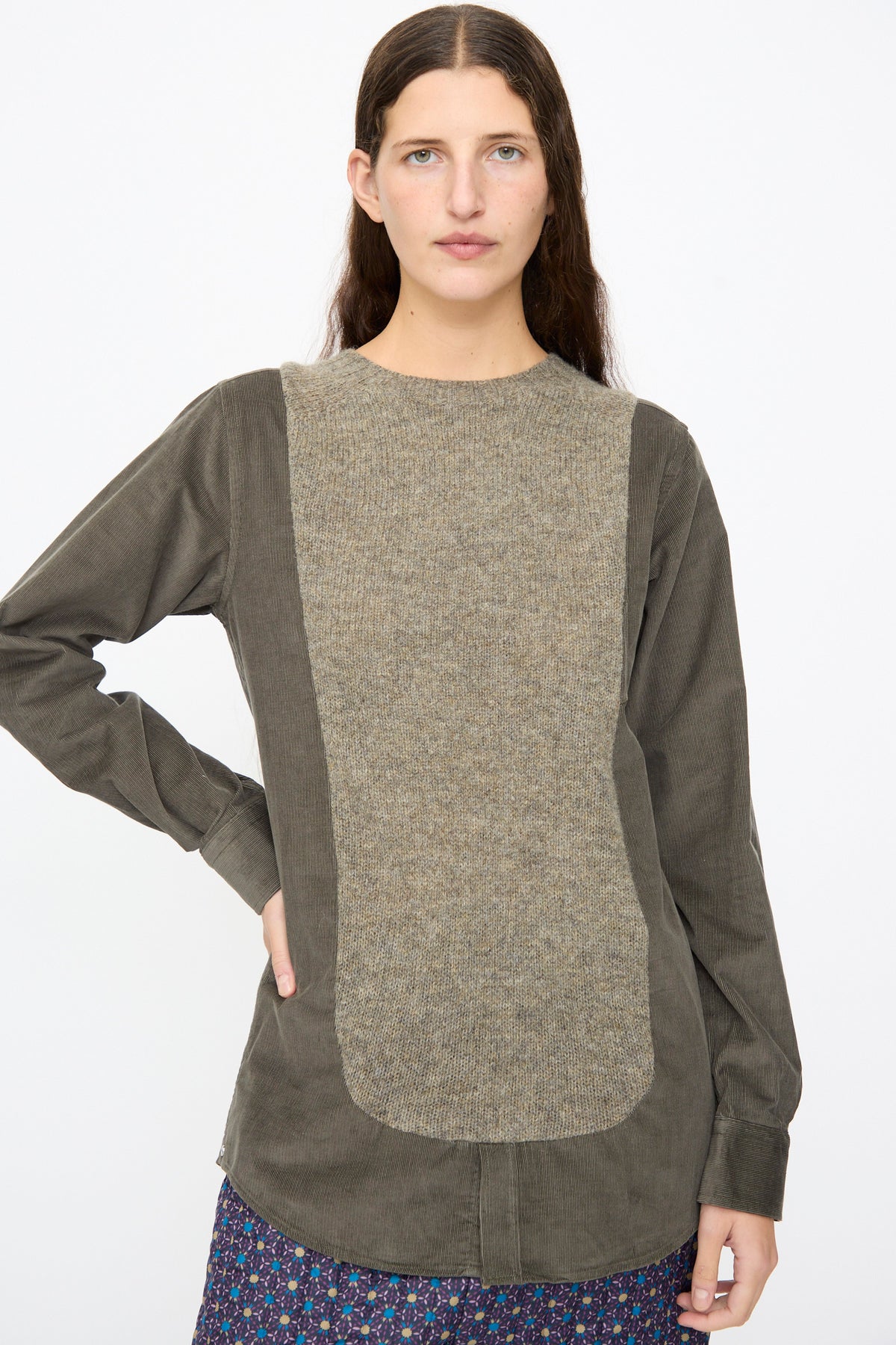 A Bless No. 68 Frontinsertpullover in Unique III, featuring a relaxed-fit, long-sleeved olive-green design with a contrasting, textured beige corduroy chest panel.