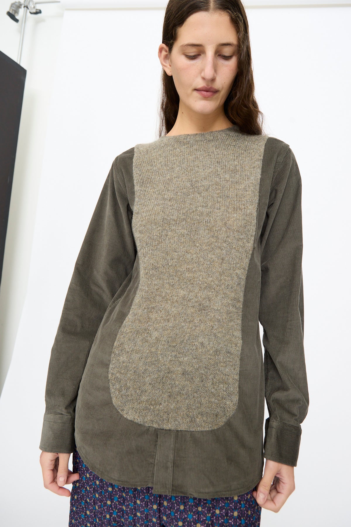 The Bless No. 68 Frontinsertpullover in Unique III is a relaxed fit, long-sleeved olive green corduroy pullover with a large, textured tan knit panel on the chest.
