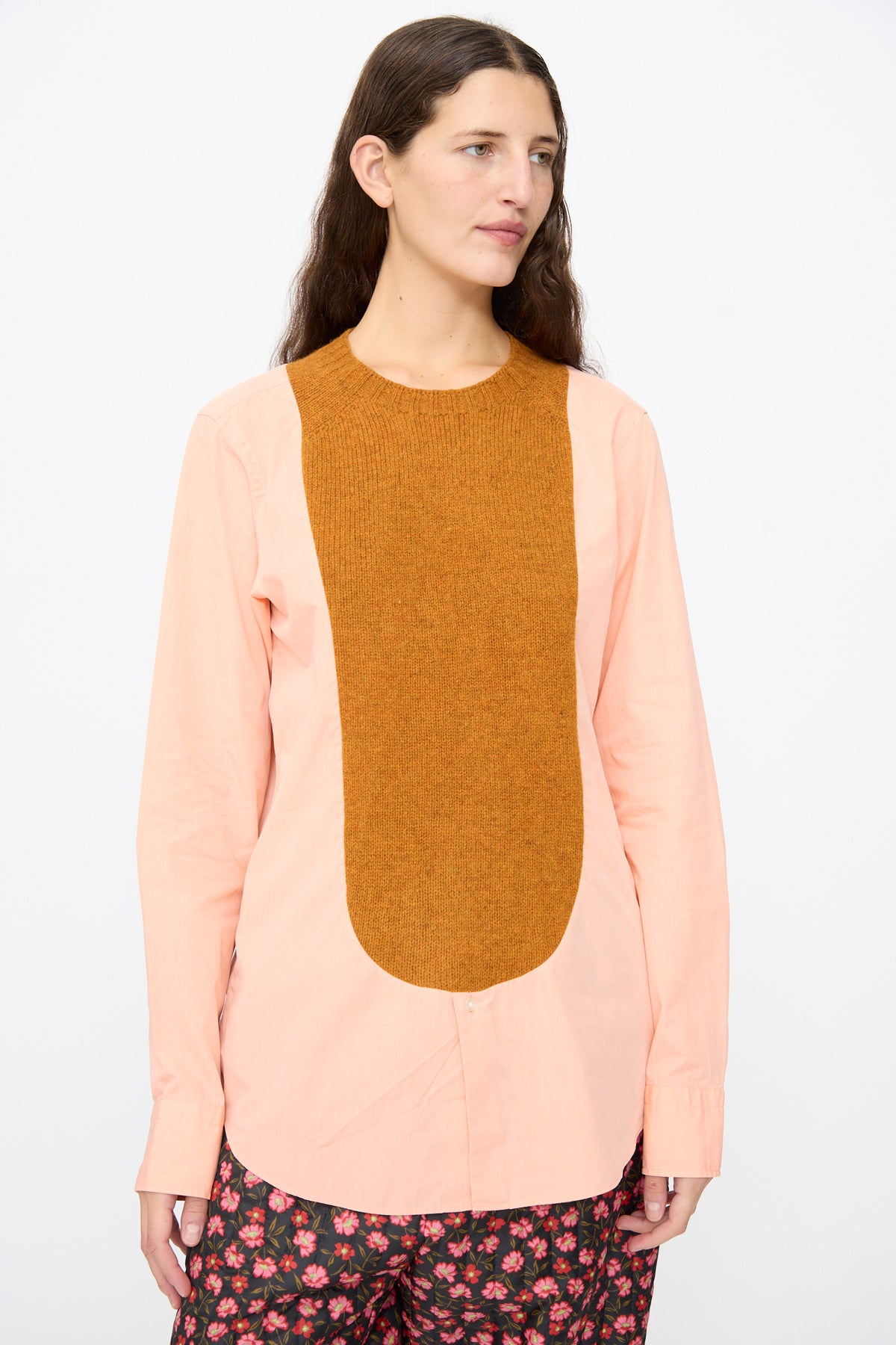 Bless No. 68 Frontinsertpullover in Unique V, a light peach long-sleeved pullover with a wide, rust-colored knit panel centered on the chest.