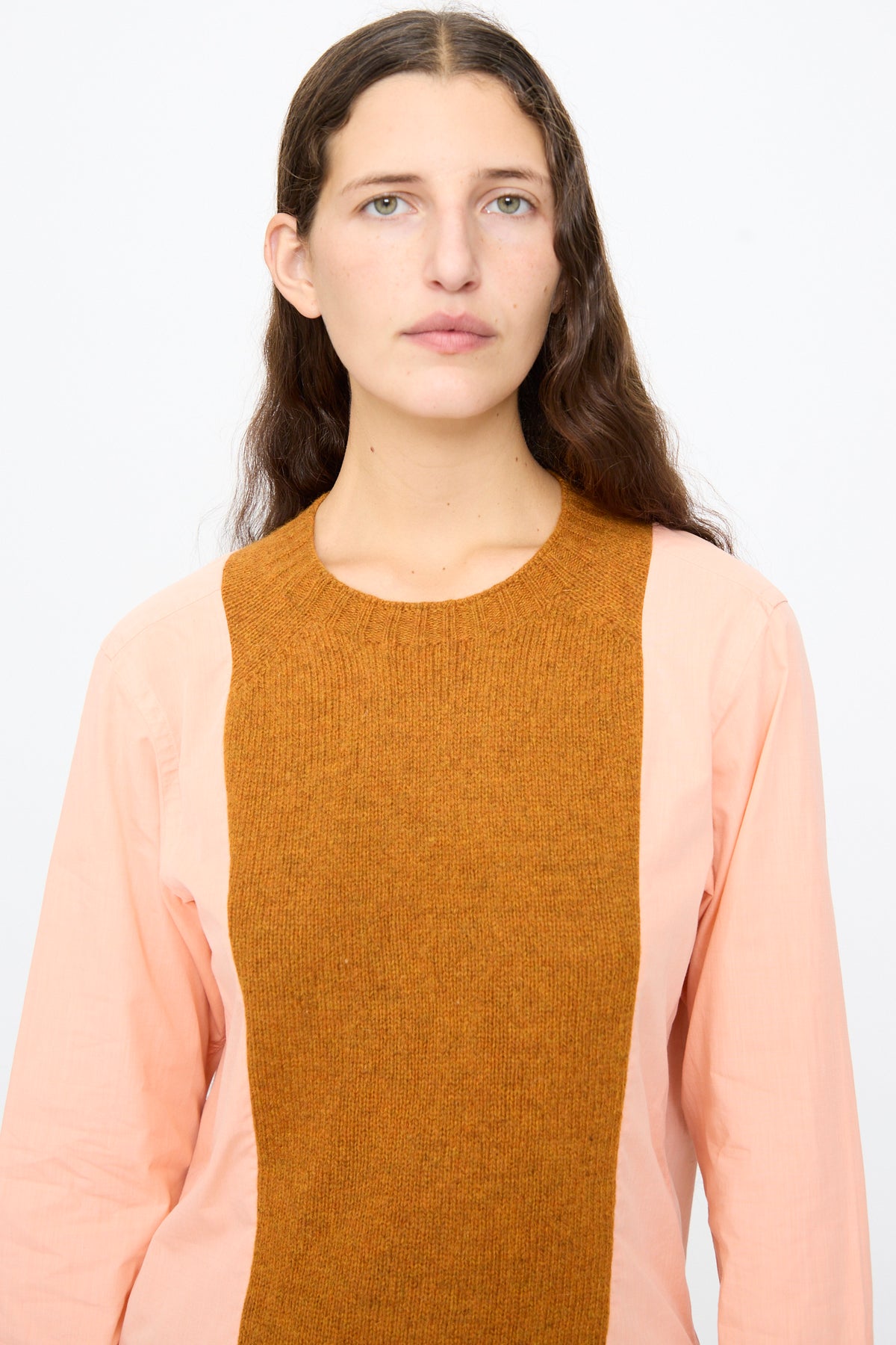 A person wears a Bless No. 68 Frontinsertpullover in Unique V, featuring a large knit front panel.