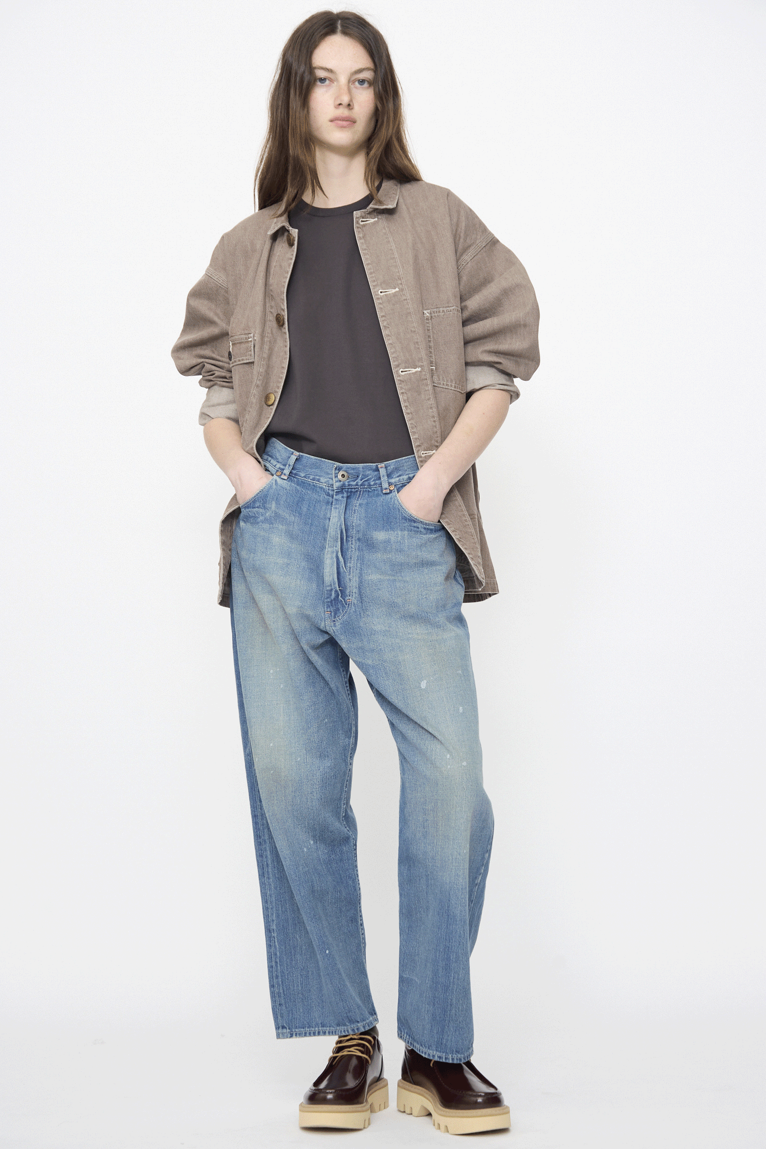 A gif of a woman wearing pieces from Chimala's SS26 collection against a white wall.