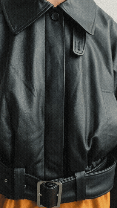 A video of a woman wearing Cawley's Nappa Leather Nara Jacket in Black against a white background.