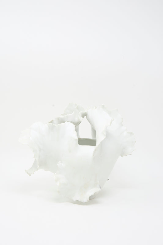 Roots N3 Sculpture in White by Chala Toprak—an artisanal white porcelain piece with an irregular, wavy-edged form reminiscent of sculpted clay—displayed against a plain white background.