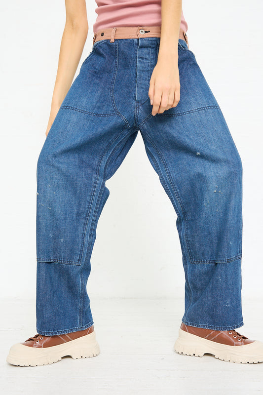 A person wearing the Chimala Denim Double Knee Work Pant in Indigo crafted by Japanese denim artisans and brown shoes, with the upper body cropped out of the frame.