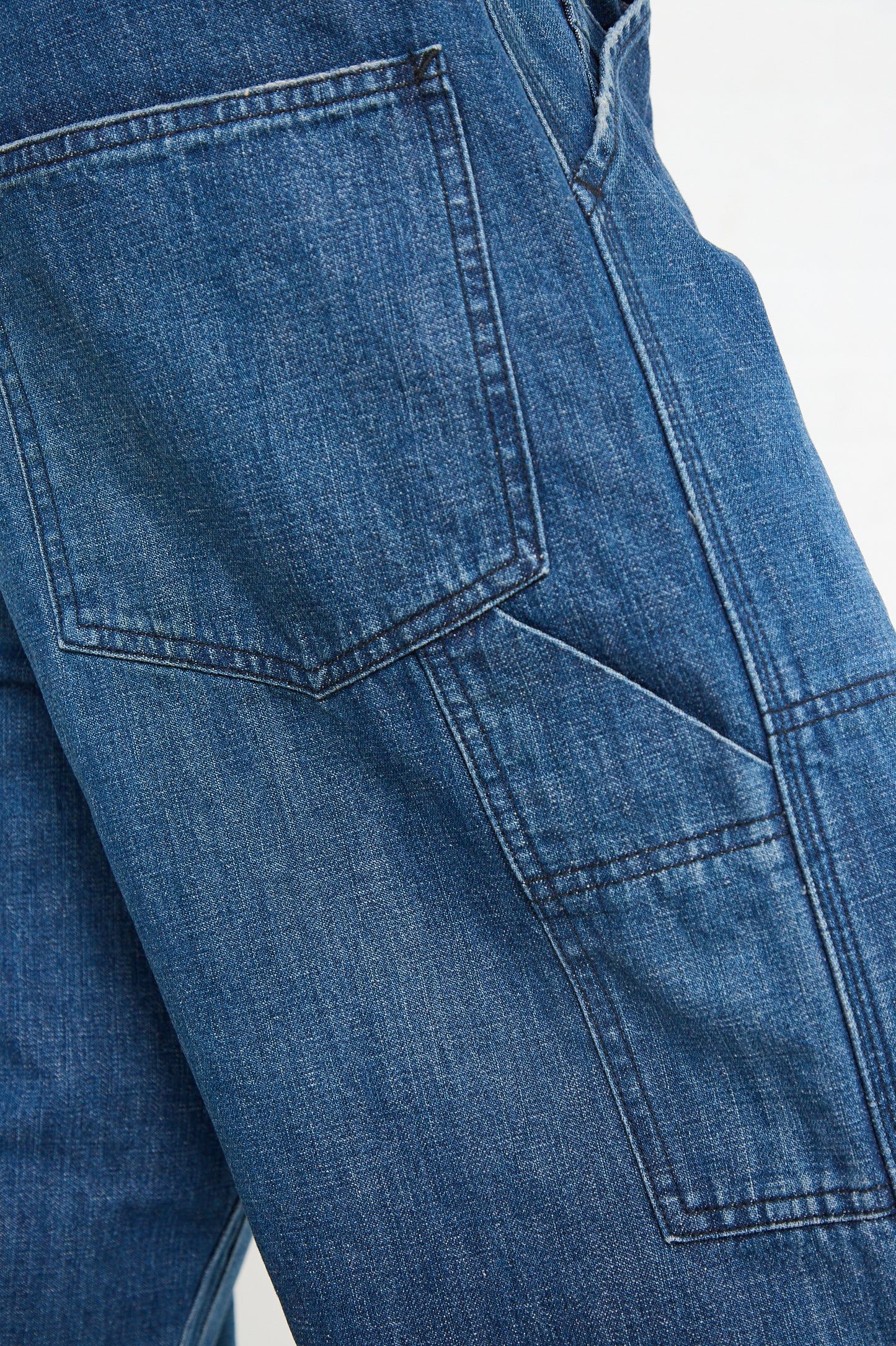 Close-up of the back pocket and seam of blue Denim Double Knee Work Pant in Indigo jeans crafted by Chimala's Japanese denim artisans.