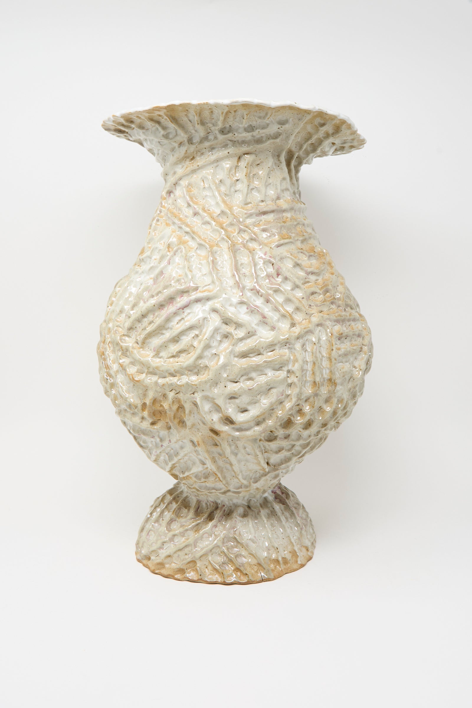 The Large Ridge Pedestal Vase in White by Claire Resnick Ceramics features a textured, handmade ceramic design with a wide flared rim, bulbous body, and ridged patterns, finished in off-white and beige glazes and photographed against a plain white background.