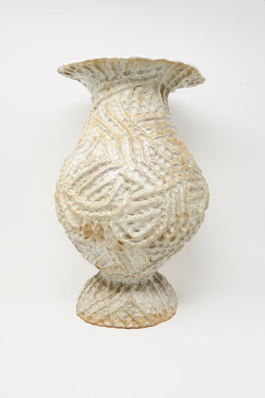 The Large Ridge Pedestal Vase in White by Claire Resnick Ceramics features a textured, handmade ceramic design with a wide flared rim, bulbous body, and ridged patterns, finished in off-white and beige glazes and photographed against a plain white background.