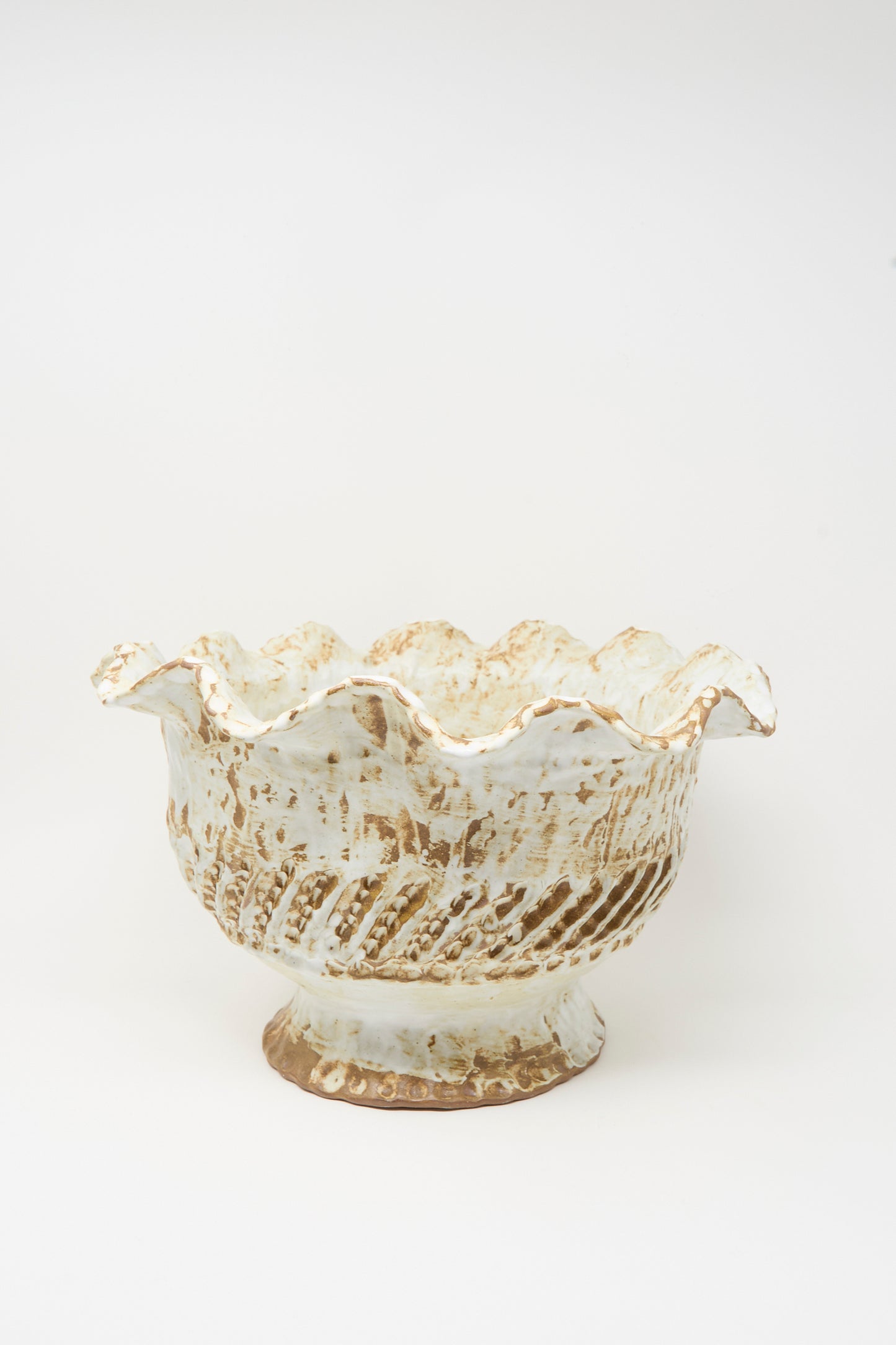 The Large Ridge Wave Bowl by Claire Resnick Ceramics is a hand-built ceramic piece featuring a textured, scalloped rim and a beige and brown speckled glaze, made in the USA and photographed against a white background.