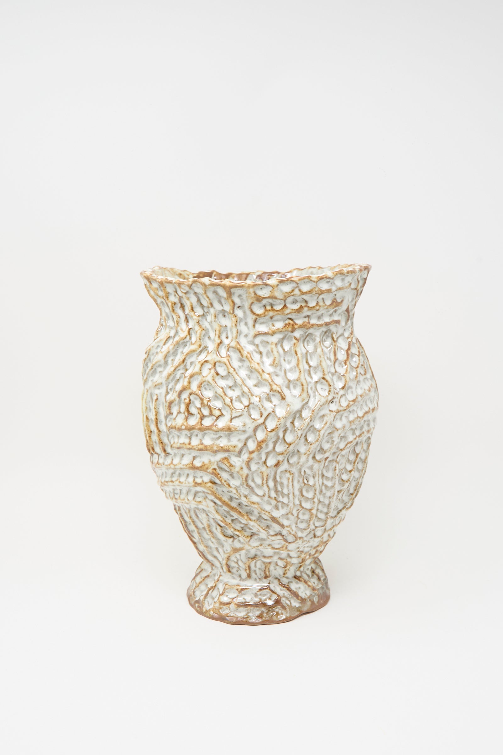 The Ridge Vase in Brown by Claire Resnick Ceramics is a hand-built ceramic piece featuring a wide mouth, textured geometric pattern, and a white glaze with brown undertones. Made in the USA, it is photographed against a plain white background.