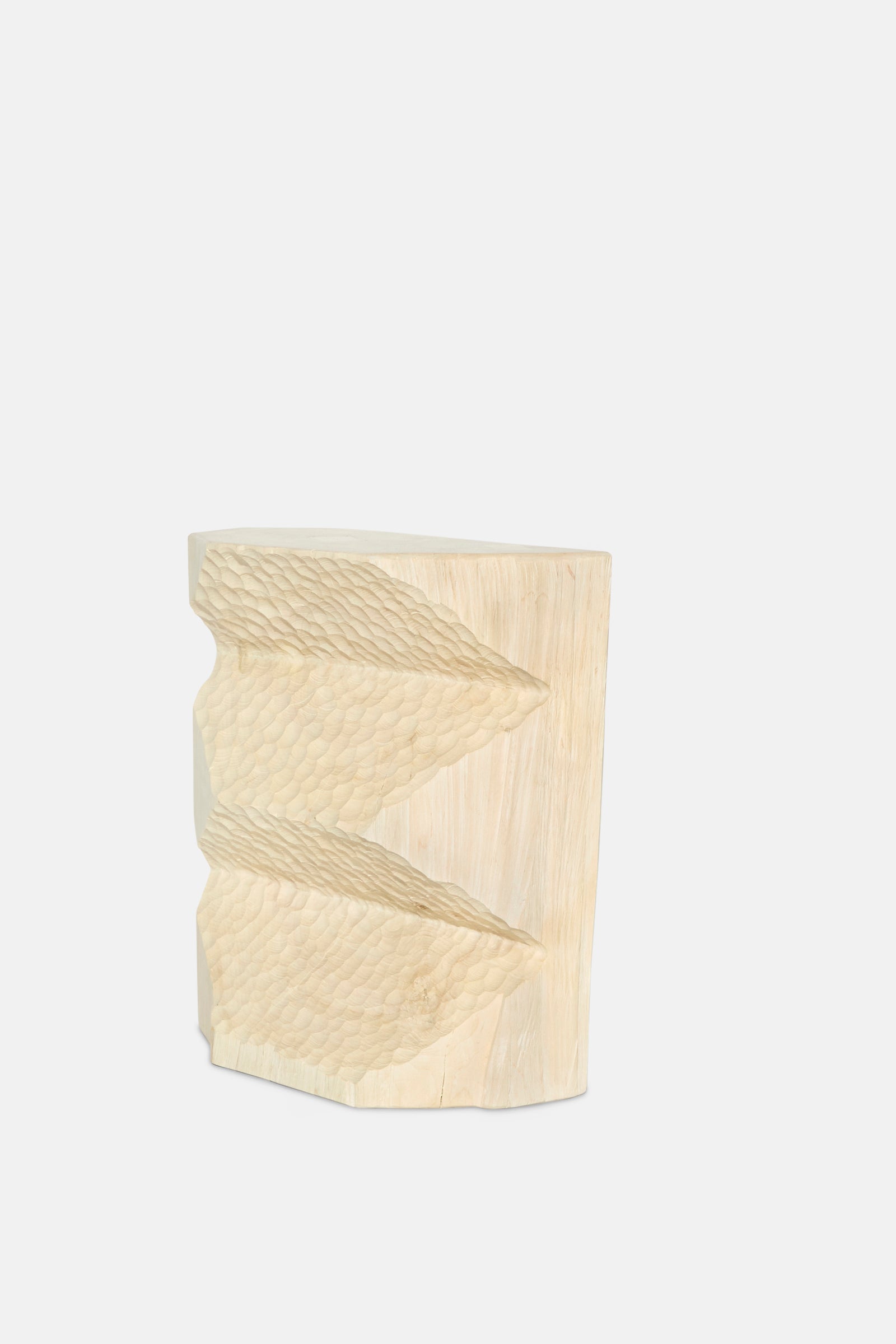The Bleached Maple Skinny I by Cody Brgant is a handmade, light-hued wood sculpture with two textured, wing-like forms on one side—evoking a sculptural side table—displayed against a plain white backdrop.
