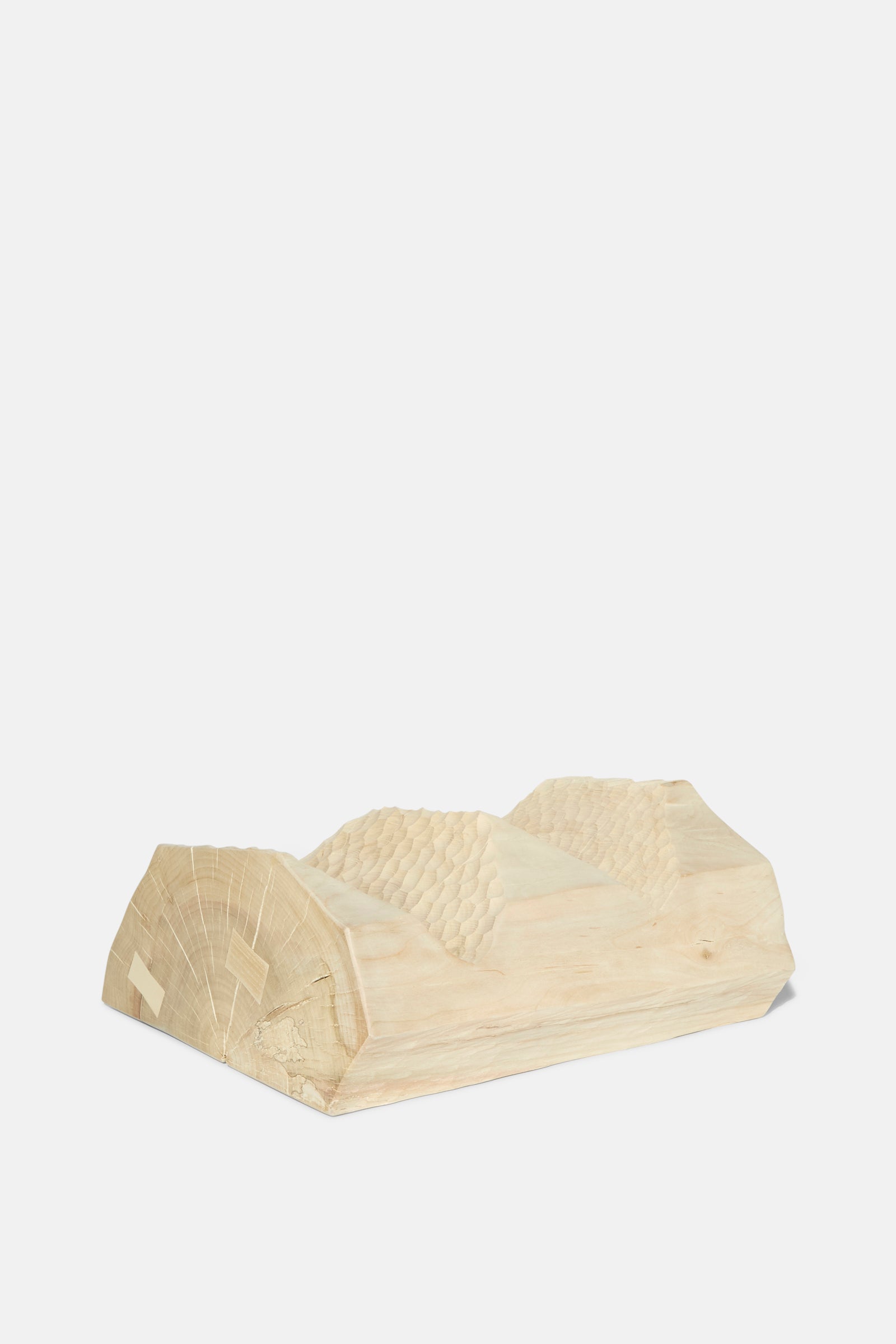 The Bleached Maple Skinny I by Cody Brgant is a sculptural side table with wavy carved indentations and visible grain, handmade in Brooklyn. Shown here on a white background.