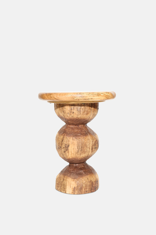 The Bon Bon Side Table with Top by Cody Brgant features a round black walnut top and sculpted geometric base, handmade in Brooklyn. Shown against a plain white background.