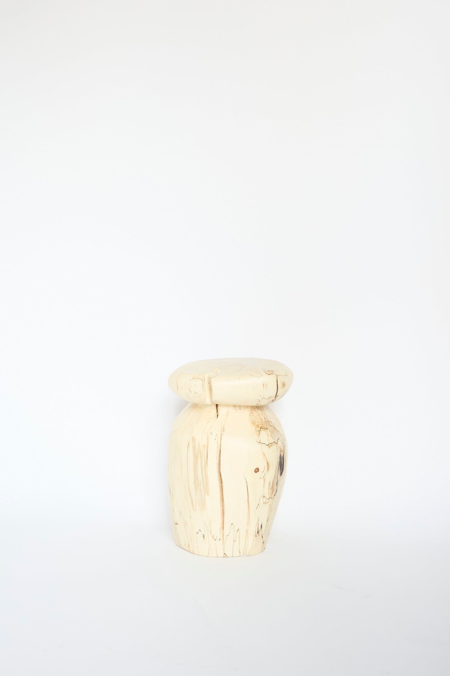 The Kingston Spalted Maple Vase by Cody Brgant is a light wooden sculpture showcasing a smooth, round top and a textured cylindrical base against a white background.