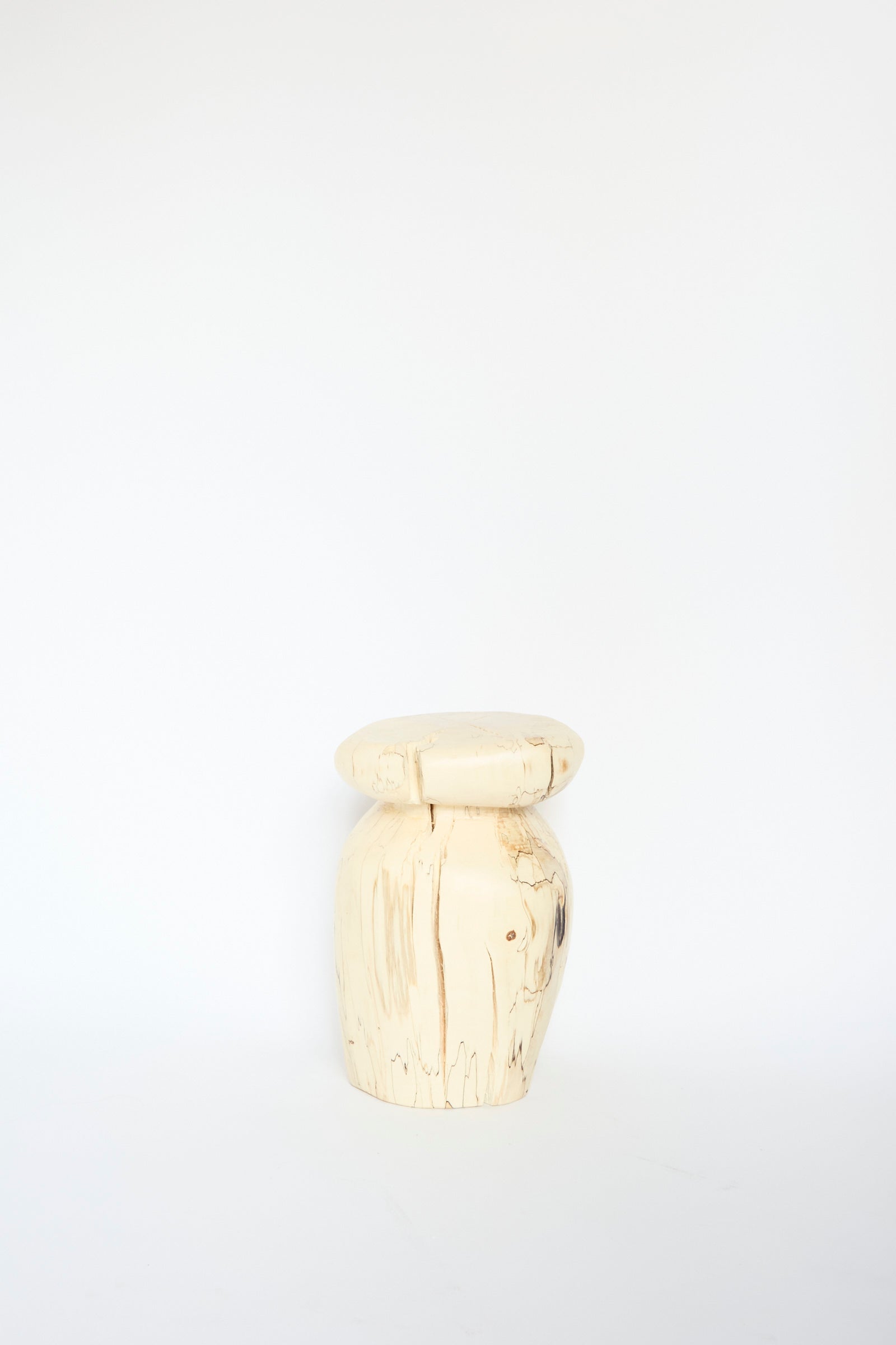 The Kingston Spalted Maple Vase by Cody Brgant is a light wooden sculpture showcasing a smooth, round top and a textured cylindrical base against a white background.