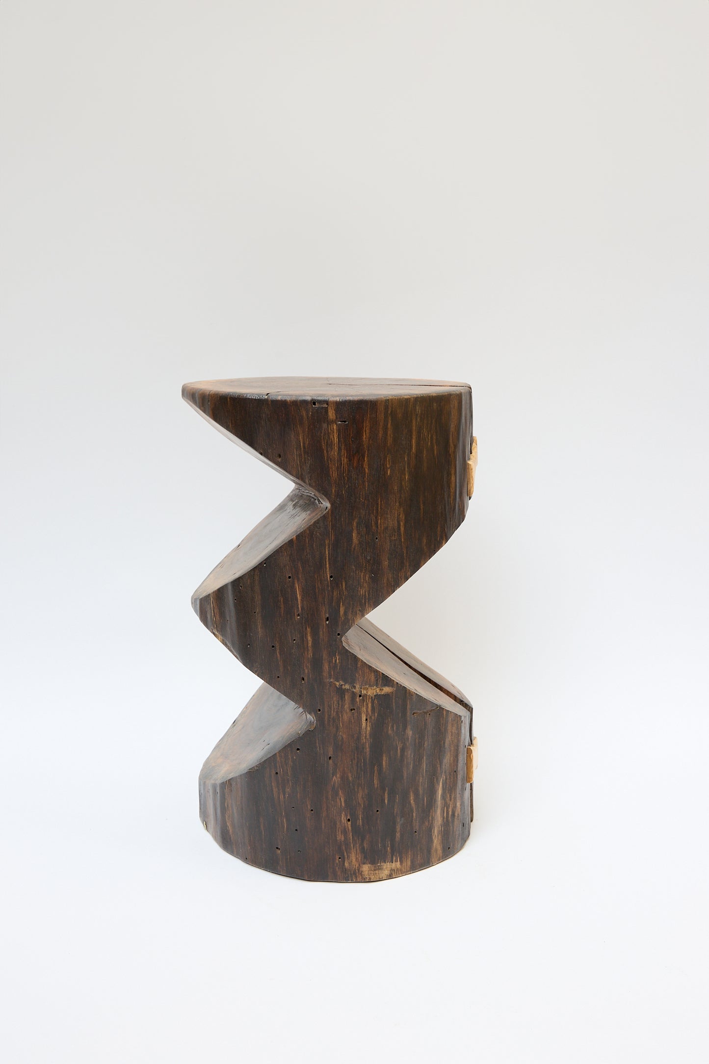 A **Cody Brgant Kingston Walnut VI Side Table** crafted from walnut tree wood with a dark finish, featuring a zigzag design in the middle, positioned against a plain white background.