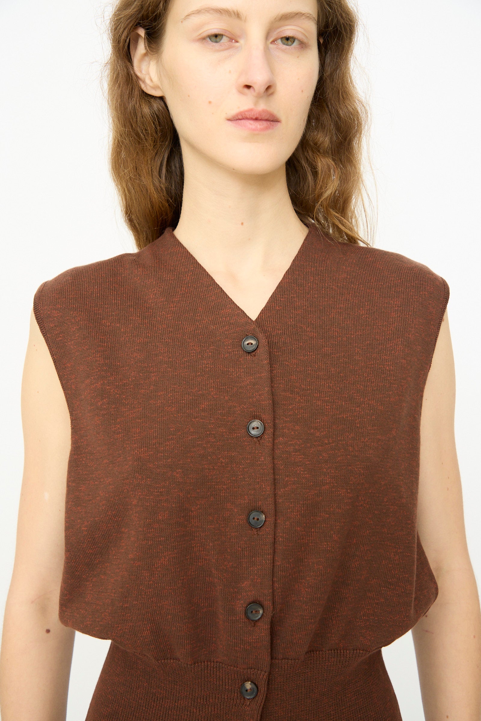 A person wearing the Cordera Flecked Cotton Waistcoat in Russet stands against a plain white background, facing forward with a neutral expression.