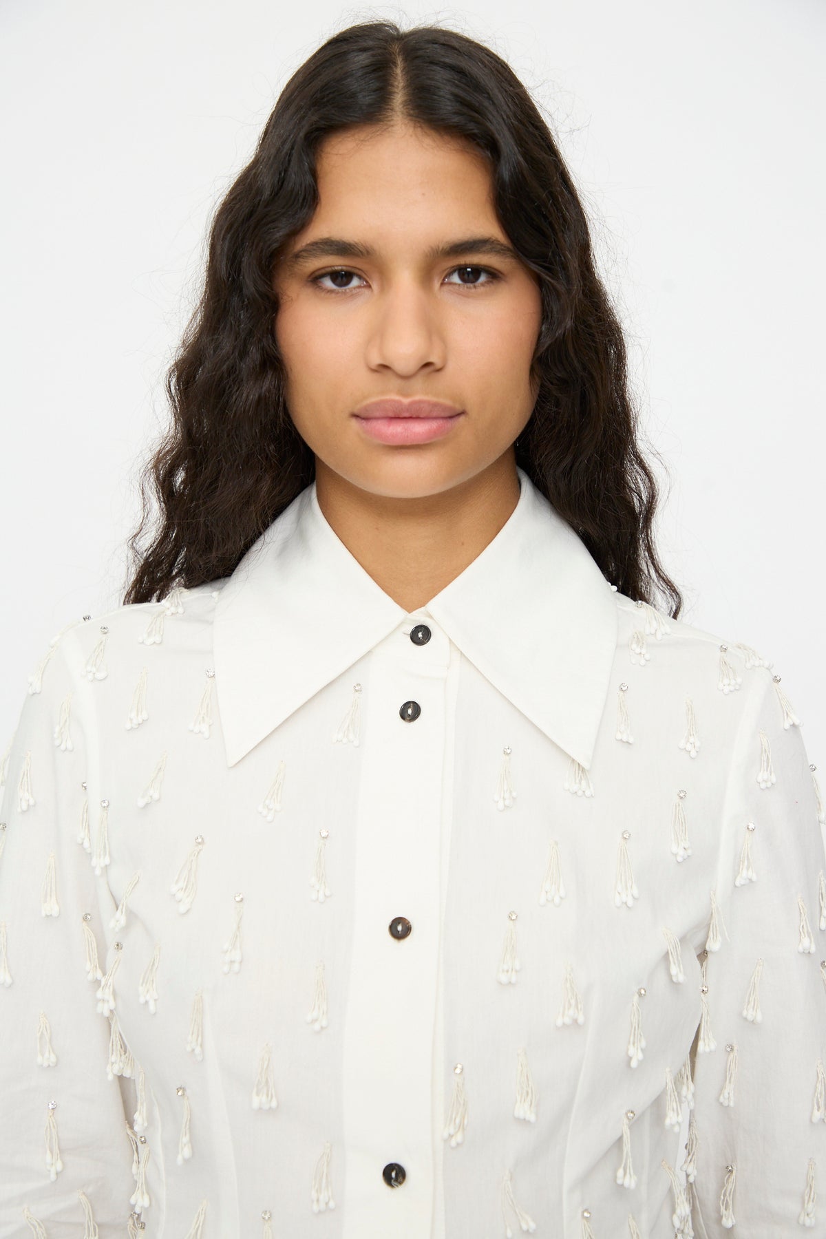 Fitted white Petalos Shirt with a pointed collar and scattered hanging fringe details.