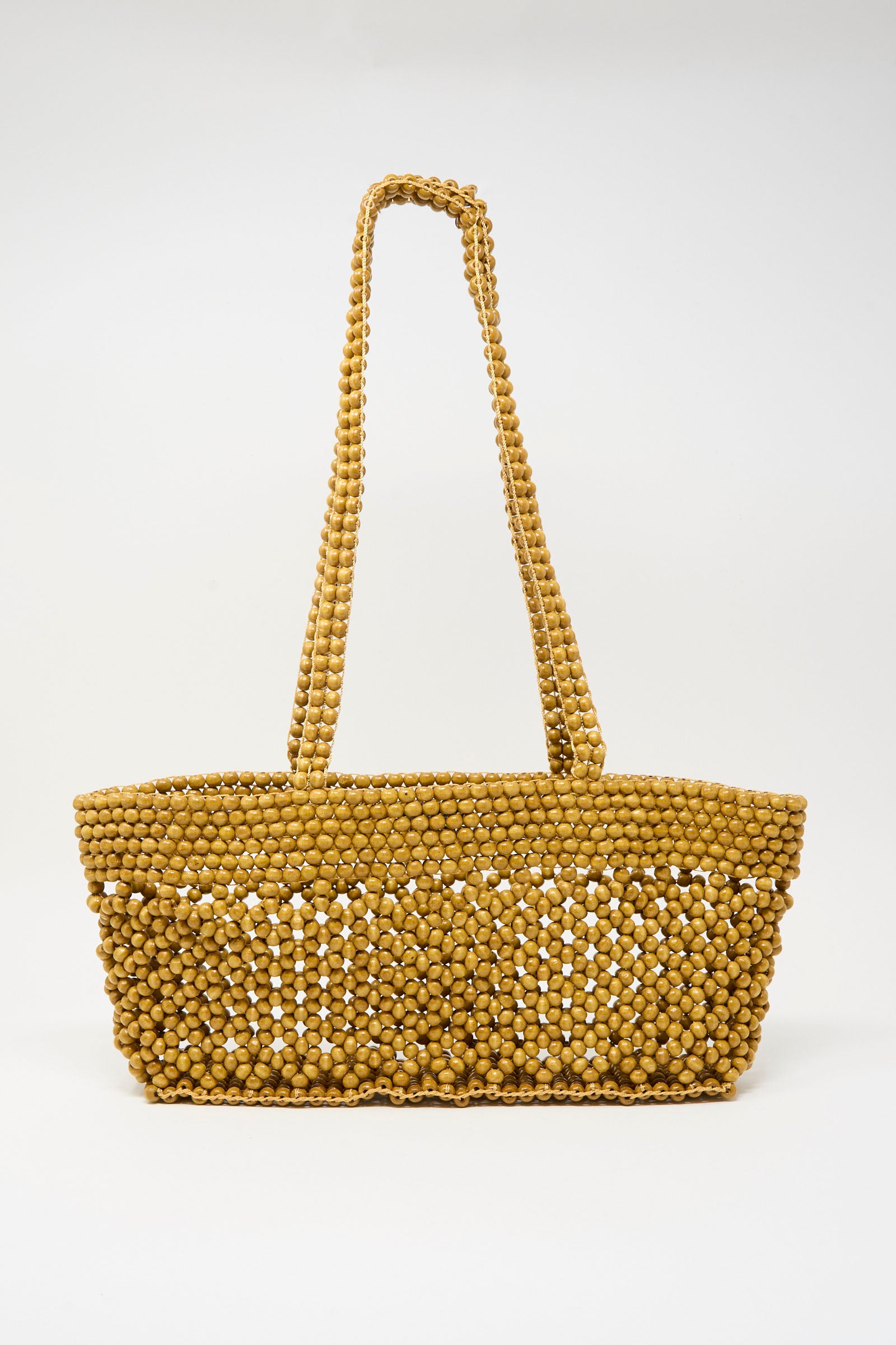 The Cordera Wooden Beads Mini Bag in Ochre features small round tan beads and two beaded shoulder straps, handmade in Guatemala and showcased against a plain white background.