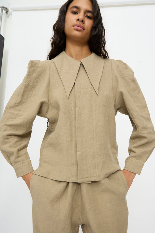 Cosmic Wonder Band Collar Shirt in beige linen wool with a pointed collar and puff shoulders.