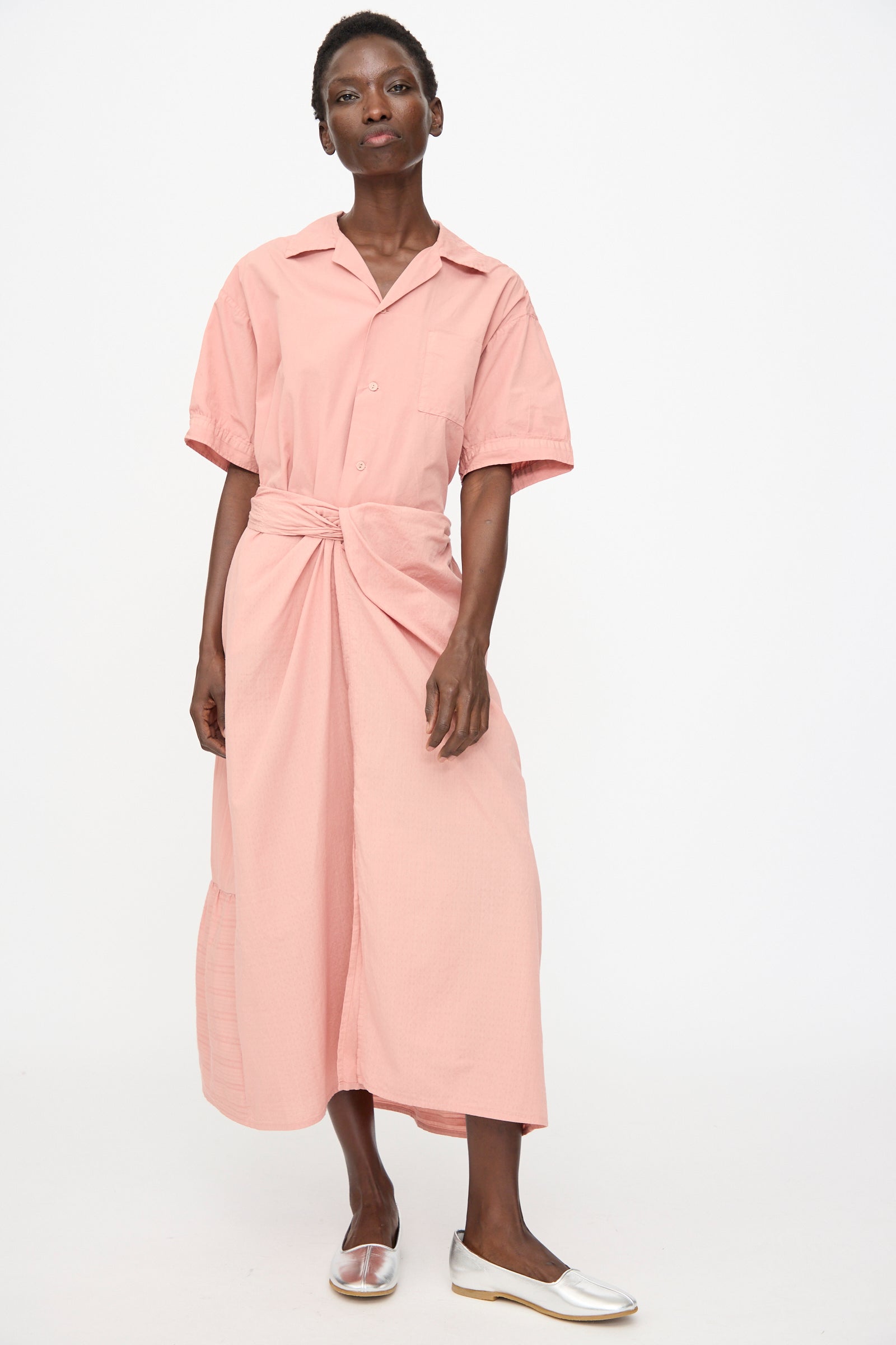 A woman in the Stripe Combination Wrapped Skirt in Rose Crystal by Cosmic Wonder.