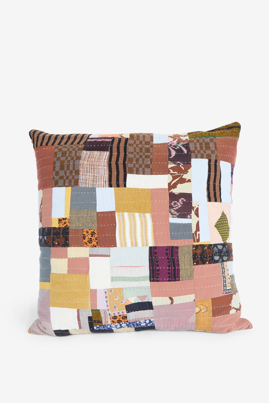 Counterpane's 28" x 28" Patchwork Pillow in Earth Multi I features a square design crafted from antique cloth, showcasing multicolored fabric squares with stripes and patterns on a white background.