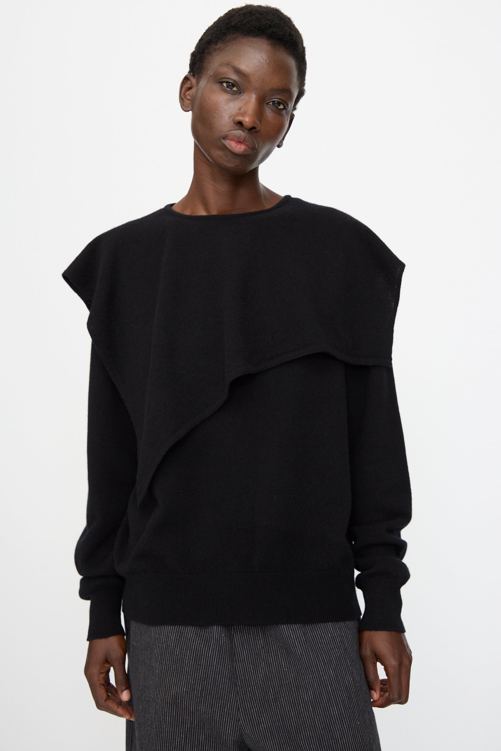 Model wears the Cristaseya Flannel Sailor Collar Sweater in Black, featuring a loose fit and layered design, standing against a plain white background.