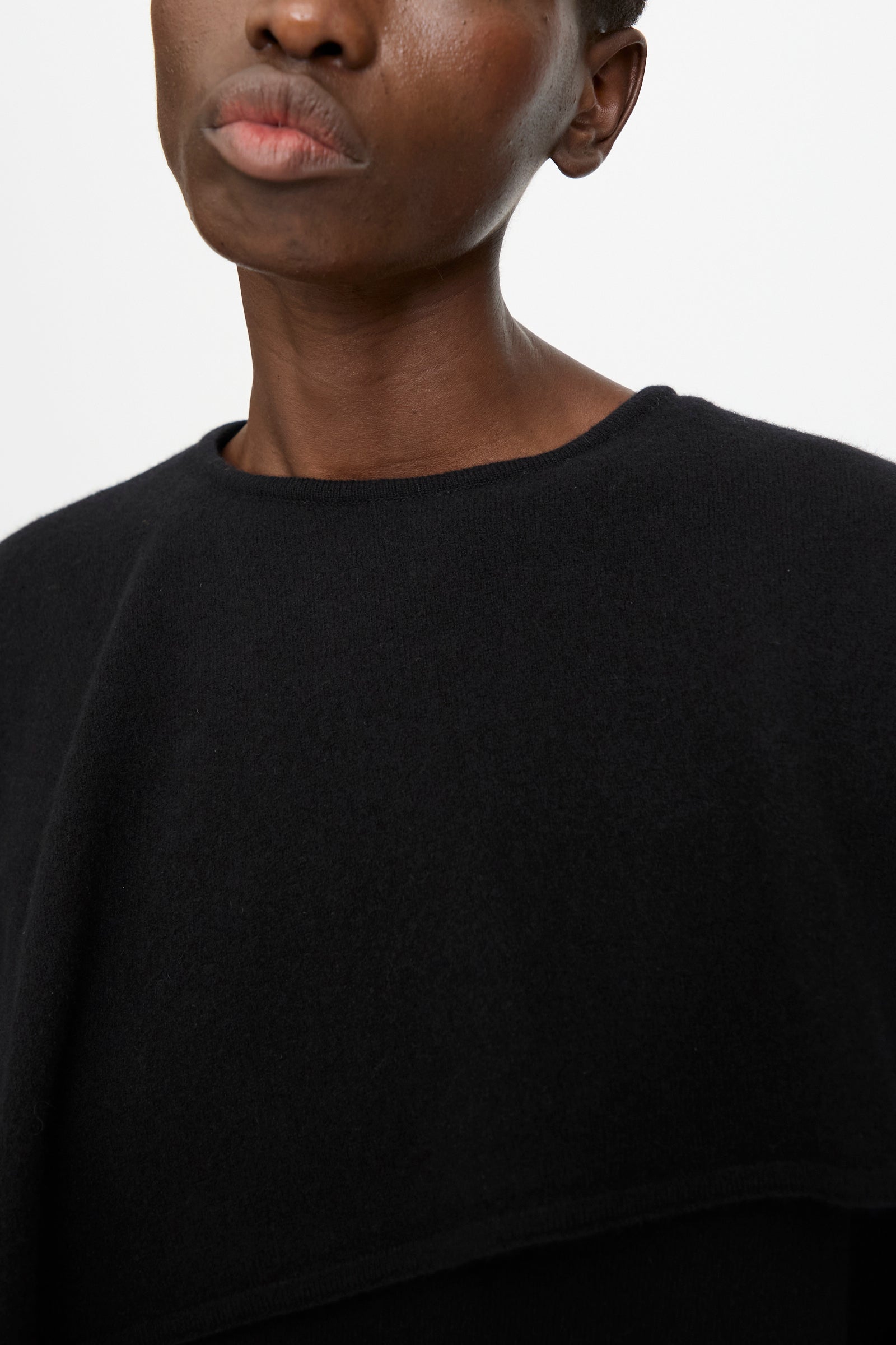 A person wearing the Cristaseya Flannel Sailor Collar Sweater in Black is shown from the shoulders up against a plain white background.