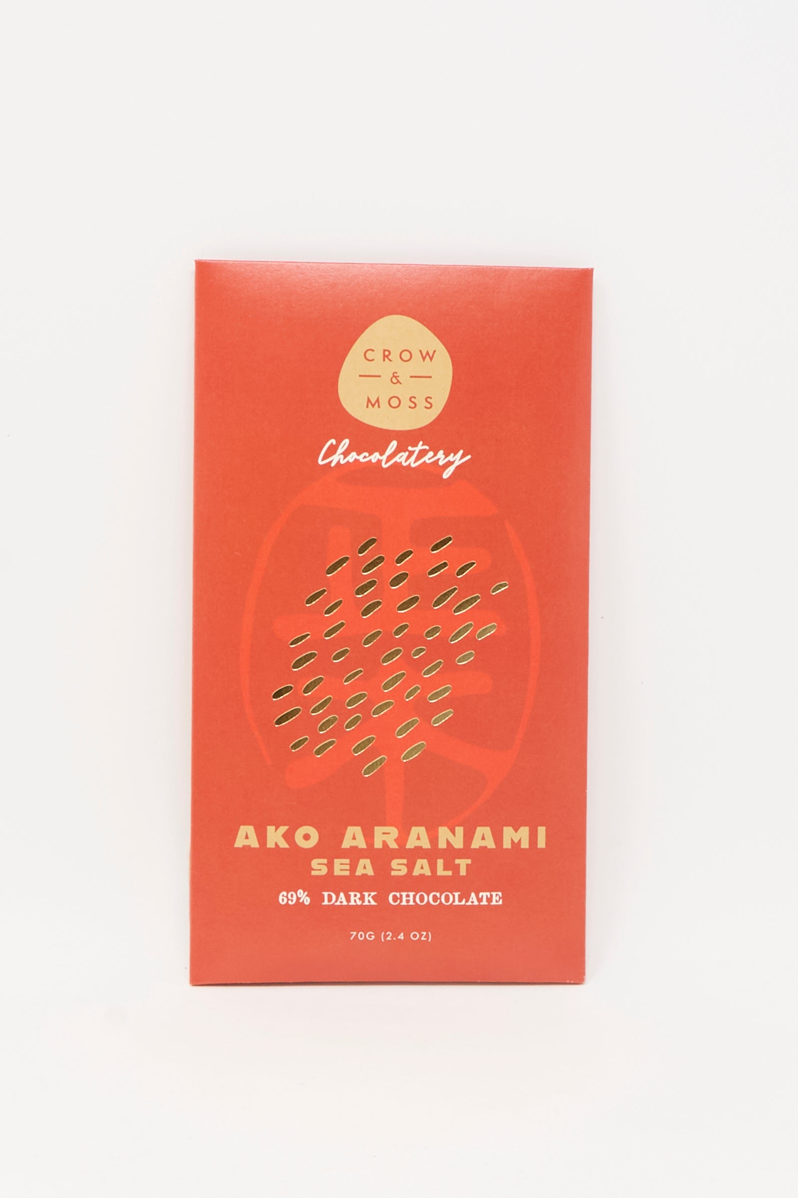 A red Crow & Moss wrapper displays "Ako Aranami Sea Salt Dark Chocolate" with a subtle abstract pattern.
