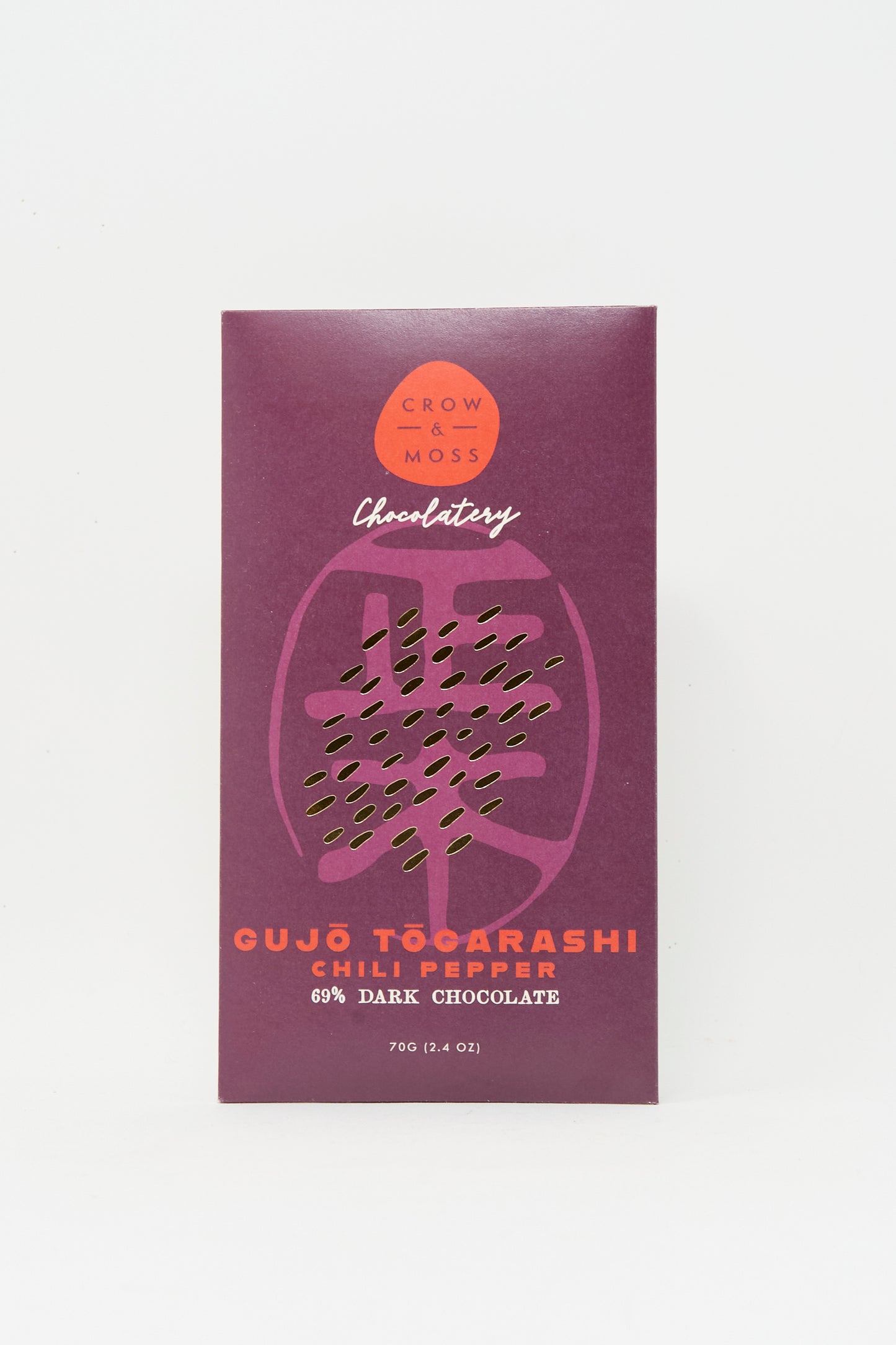 A 70g Crow & Moss Togarashi Chili Dark Chocolate Bar, made with single-origin Wampusirpi cacao, features a striking purple wrapper with orange text.