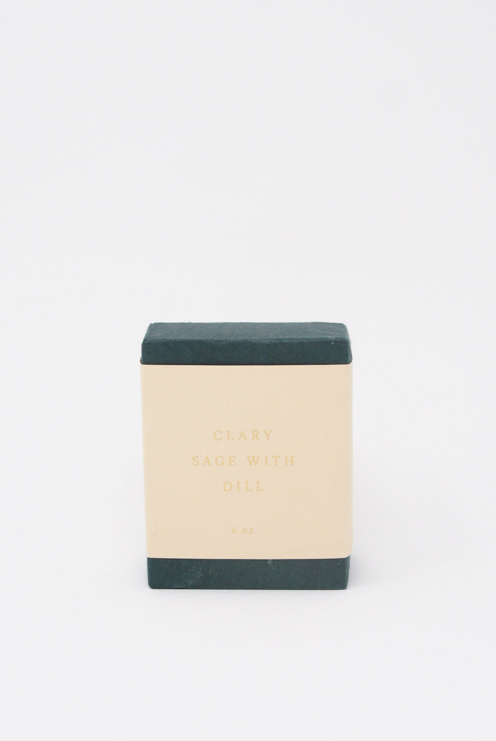 A square black soap bar with a beige label reading "Olive Oil Soap in Clary Sage with Dill," indicating a weight of 6 ounces. Handcrafted in New York, this luxurious SAIPUA soap features the soothing benefits of clary sage essential oil.