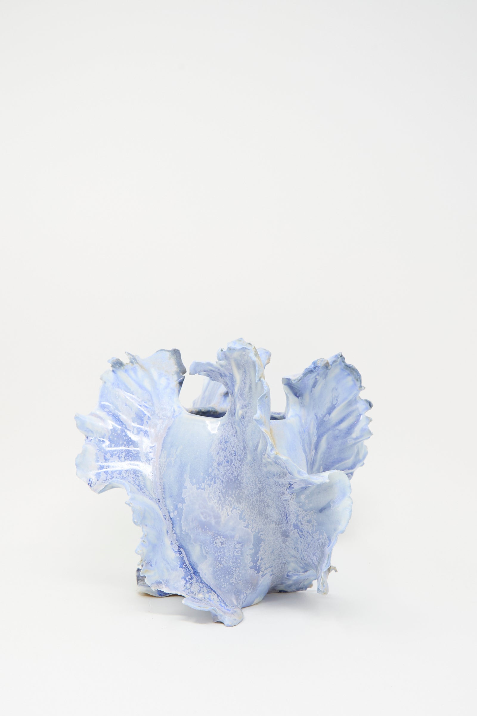 The Ash Bloom N.8 Woodfired in Blue by Dear You is a light blue porcelain vase with wavy, textured edges and a handmade feel, displayed against a plain white background.