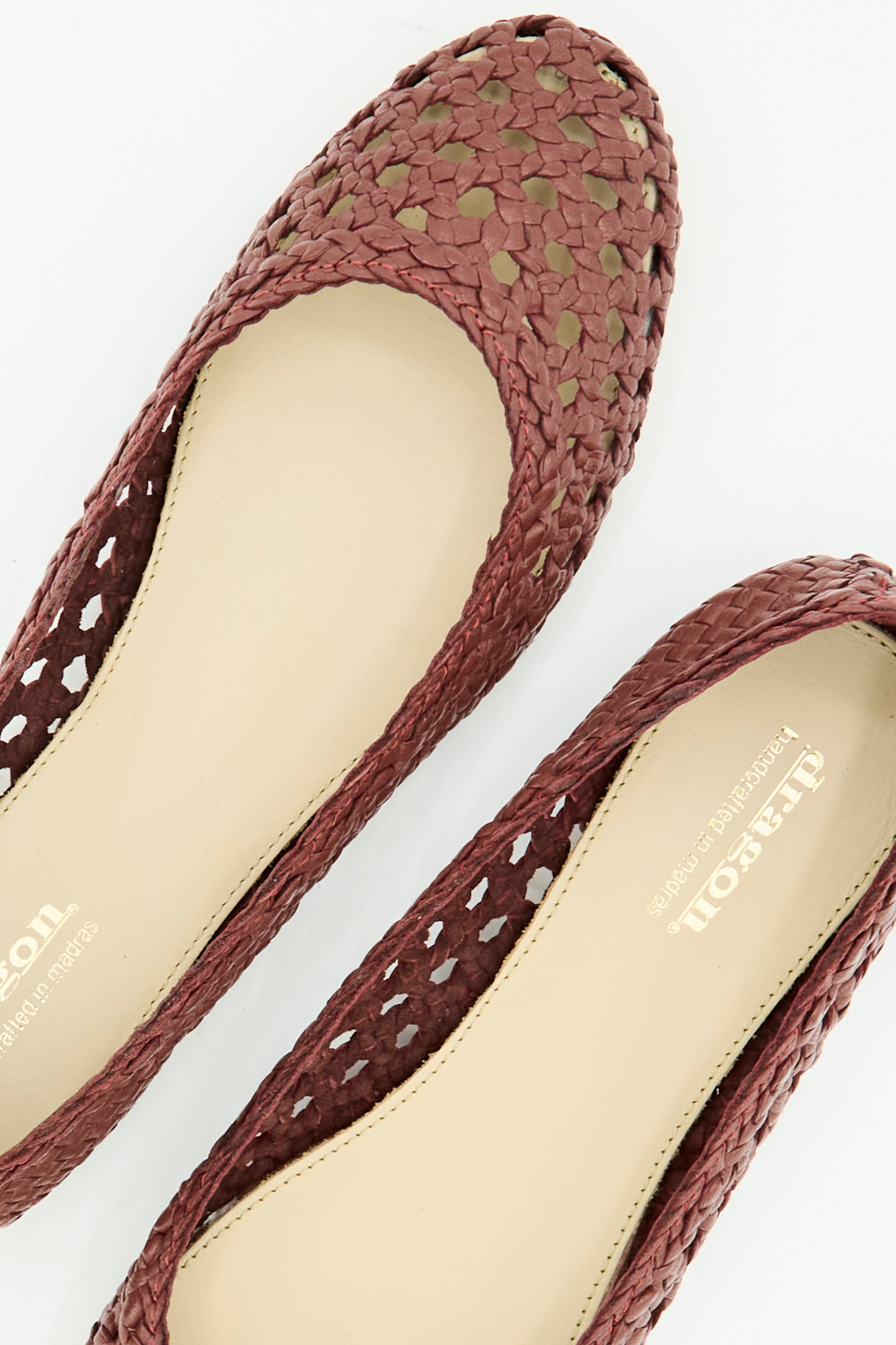 The Capri Ballerina in Bordo by Dragon Diffusion features woven leather, round toes, and beige insoles, shown from above on a white background.