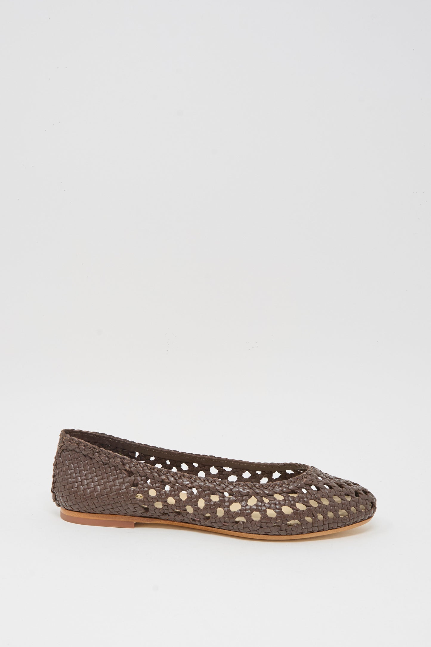 The Capri Ballerina in Dark Brown by Dragon Diffusion is a woven goat leather flat with a round toe and cutout pattern, displayed against a plain white background.