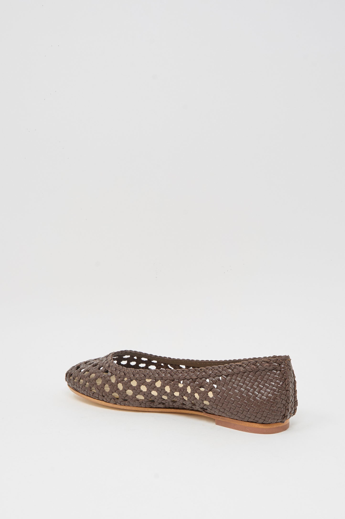 The Capri Ballerina in Dark Brown by Dragon Diffusion is a closed-toe woven goat leather flat with cutout design, displayed on a plain white background.