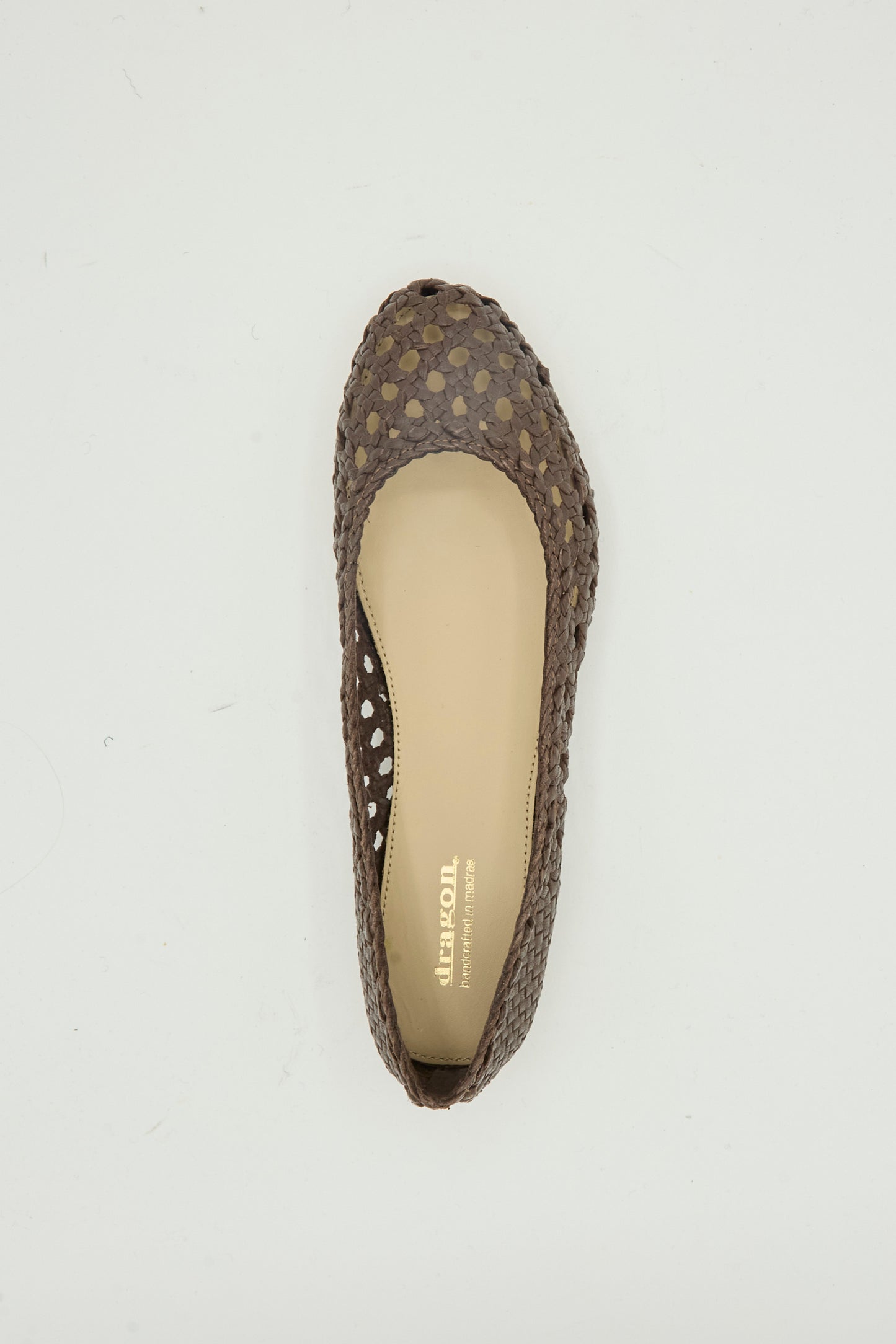The Capri Ballerina in Dark Brown by Dragon Diffusion is a single flat with a rounded toe, crafted from woven goat leather and shown from above on a plain white background.