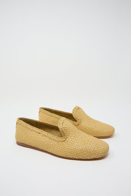 A pair of beige Dragon Diffusion Damas Slipper in Natural handwoven leather slippers on a white background.