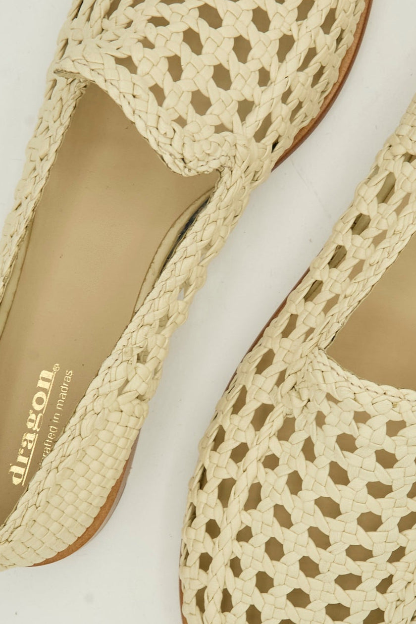Close-up of the Dolly Moccasin in Off White by Dragon Diffusion, featuring woven goat leather.