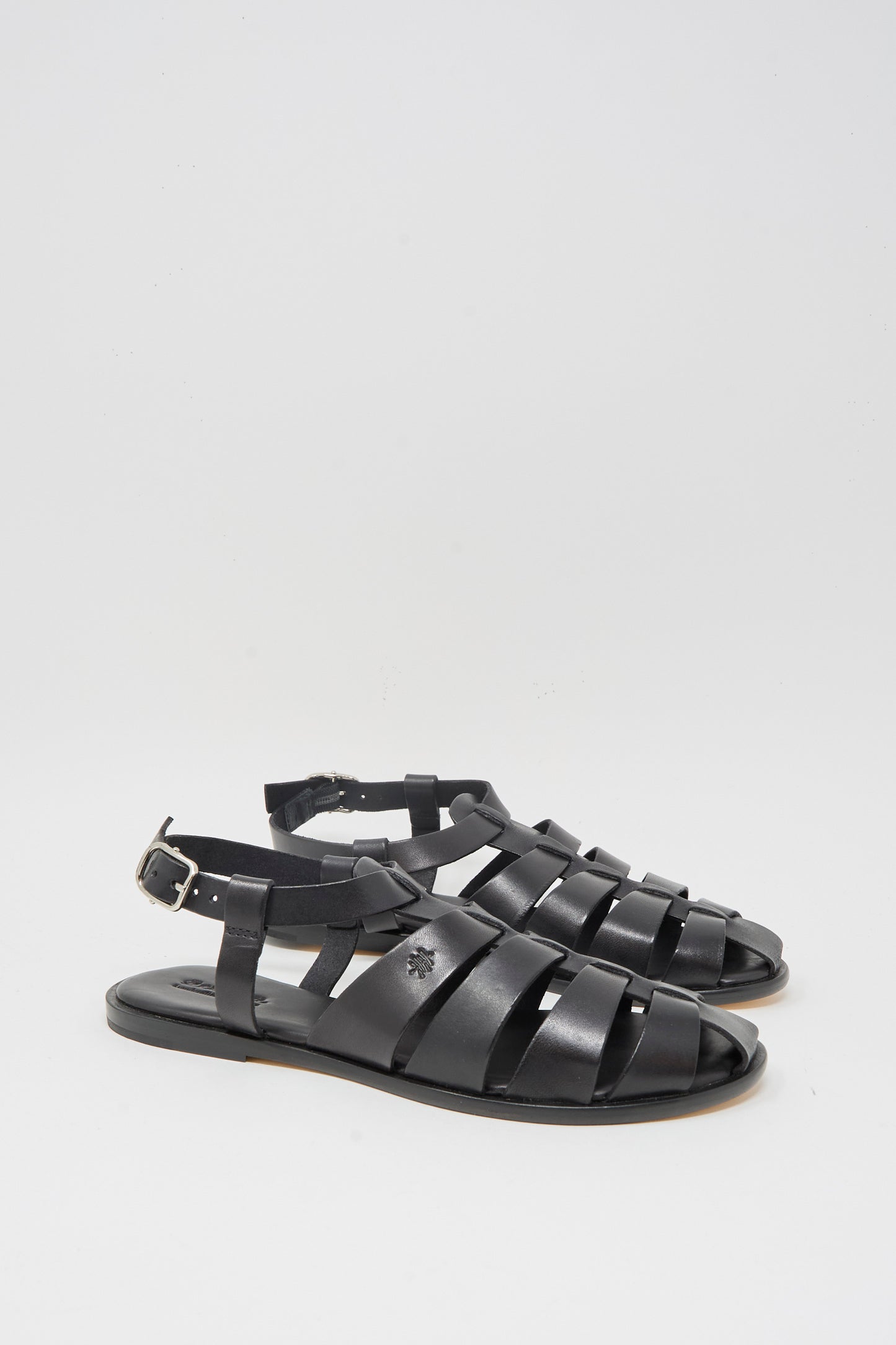 The Dragon Diffusion Pescador Sandal in Black features handcrafted cow leather with multiple straps and a buckle closure, shown against a plain white background.