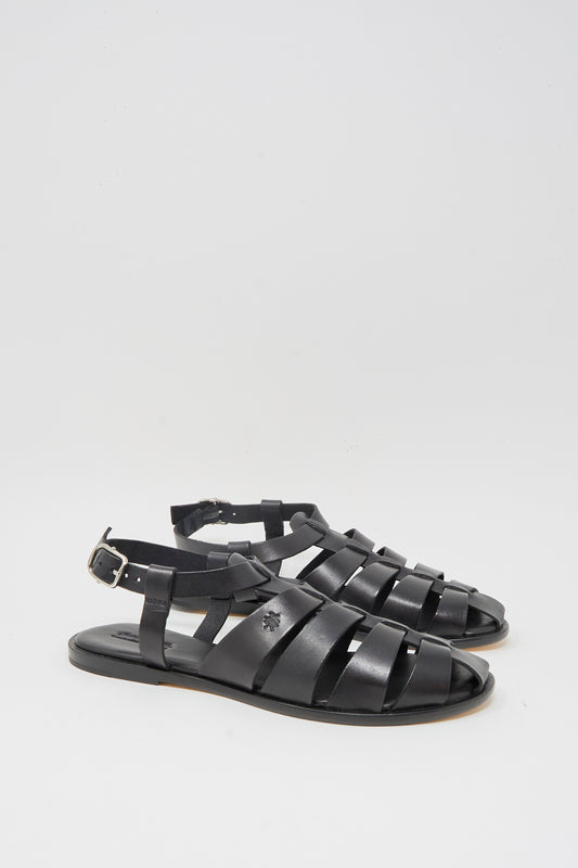 The Dragon Diffusion Pescador Sandal in Black features handcrafted cow leather with multiple straps and a buckle closure, shown against a plain white background.