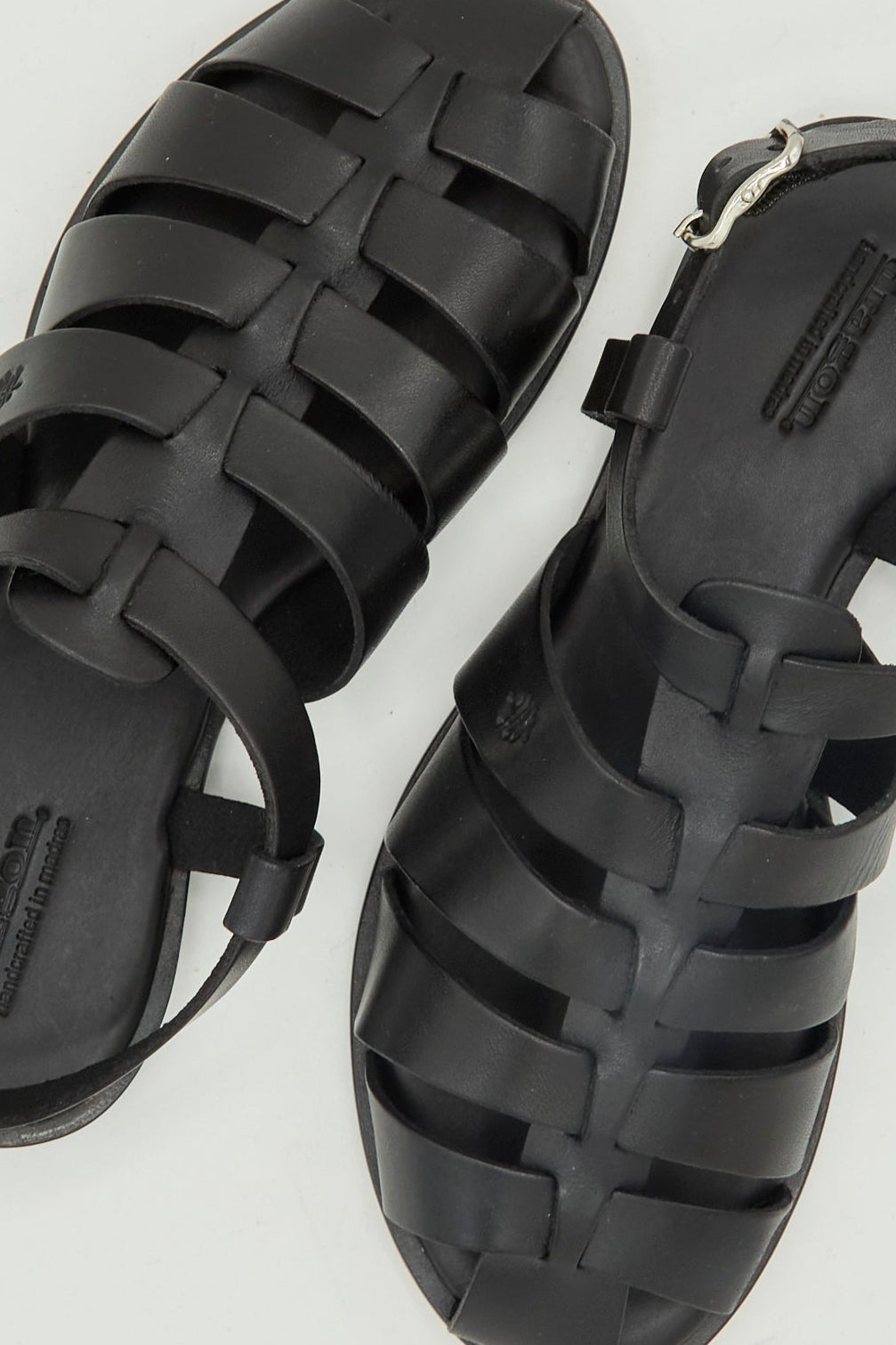 The Dragon Diffusion Pescador Sandal in Black is a handcrafted cow leather fisherman sandal with closed toes and ankle straps, shown from above on a white background.