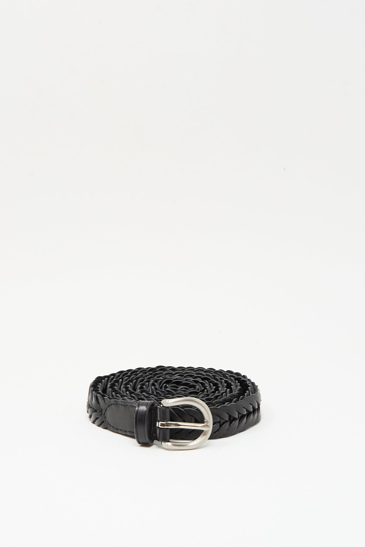 The Dragon Diffusion Single Link Belt in Black in braided black leather and finished with a metal buckle, is displayed coiled against a plain white background.