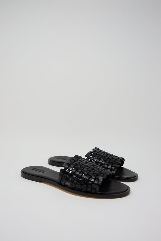 A pair of Dragon Diffusion Zig Zag Sandals in Black on a white background.
