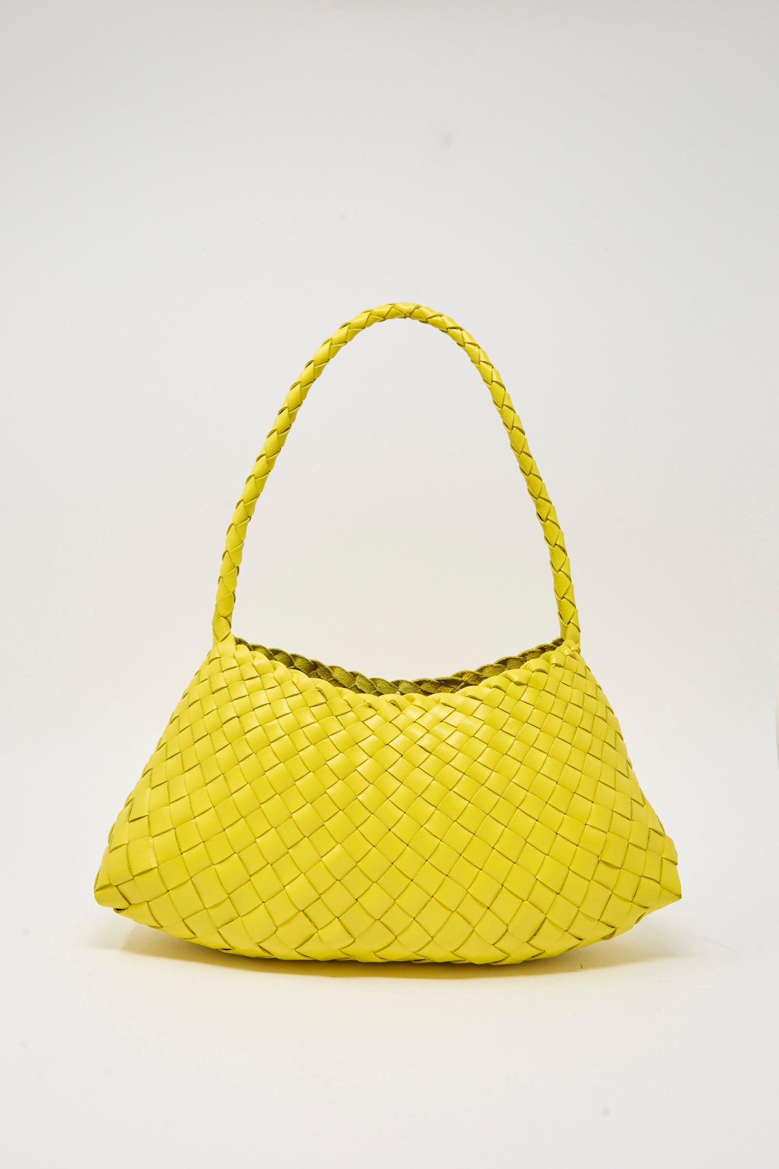 The Rosanna Bag in Yellow by Dragon Diffusion is a yellow leather bag, basket-woven with a single braided handle, shown against a plain white background.