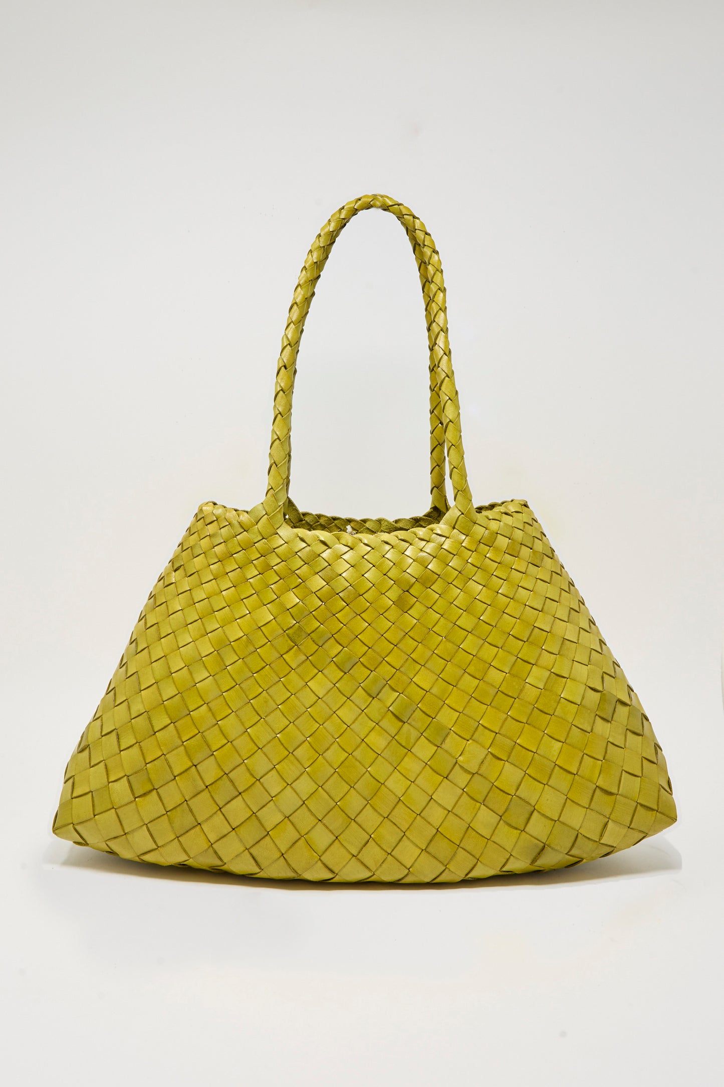 The Dragon Diffusion Santa Croce Big in Bamboo Green is a handwoven leather bag with double handles, crafted using traditional basket weaving techniques, shown against a plain white background.