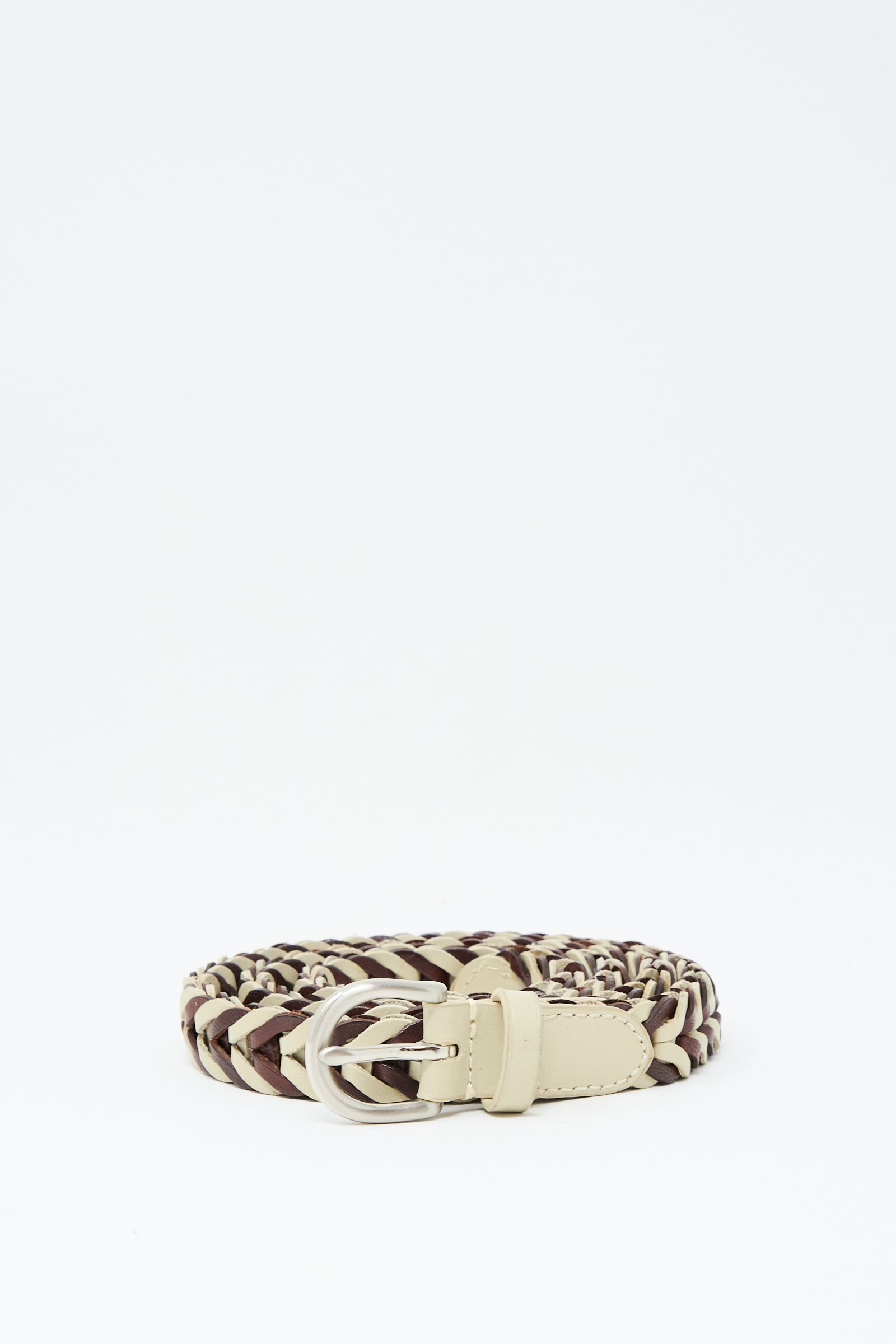The Dragon Diffusion Single Link Bi-Color Belt in Bruciato and Pearl is a handcrafted braided leather belt with a silver buckle, shown coiled on a plain white background.
