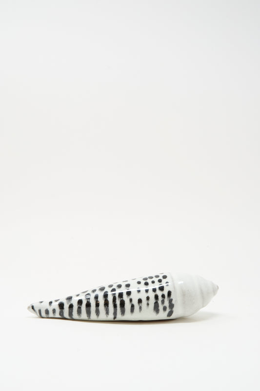 The Shell Rattle XCII by E.C.C.E features a handmade black-and-white ceramic design, crafted in NYC, and is displayed against a plain white background.