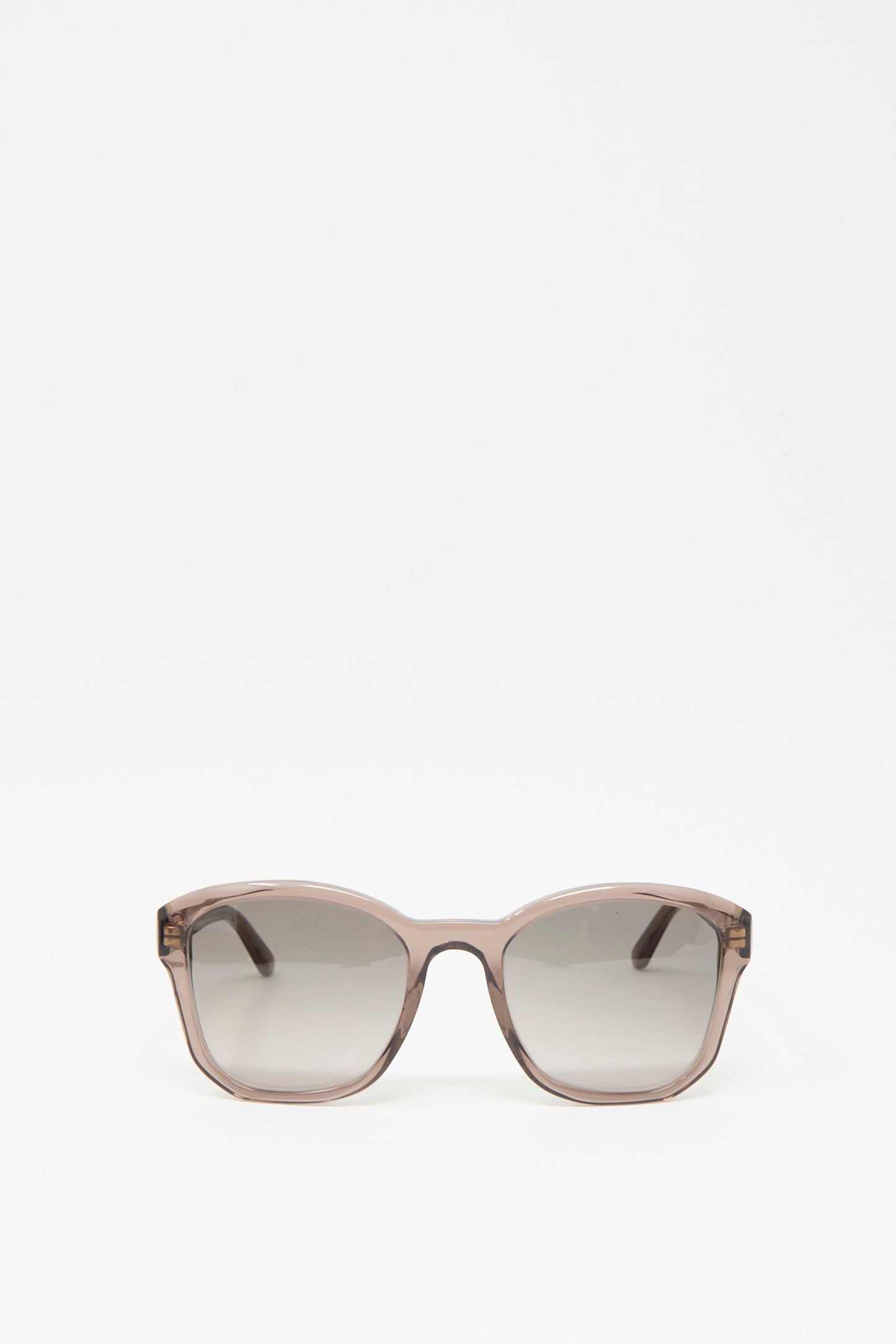 A pair of BQE Sunglasses in Bambi by Eva Masaki, featuring a box shape, brown frame, and dark lenses, handmade in Italy, displayed on a plain white background.
