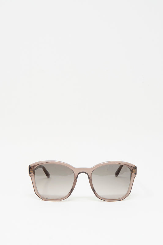 A pair of BQE Sunglasses in Bambi by Eva Masaki, featuring a box shape, brown frame, and dark lenses, handmade in Italy, displayed on a plain white background.