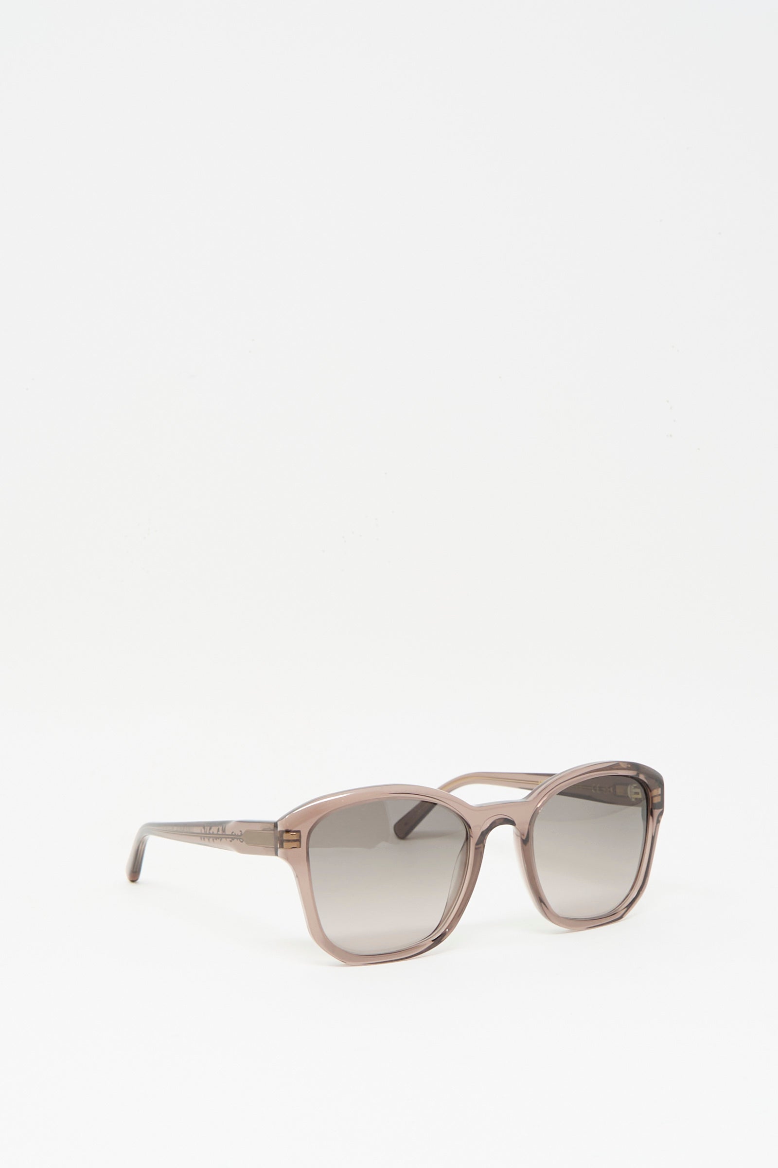 The Eva Masaki BQE Sunglasses in Bambi feature a square, light brown box shape with gray tinted lenses. Handmade in Italy, they are displayed against a plain white background.