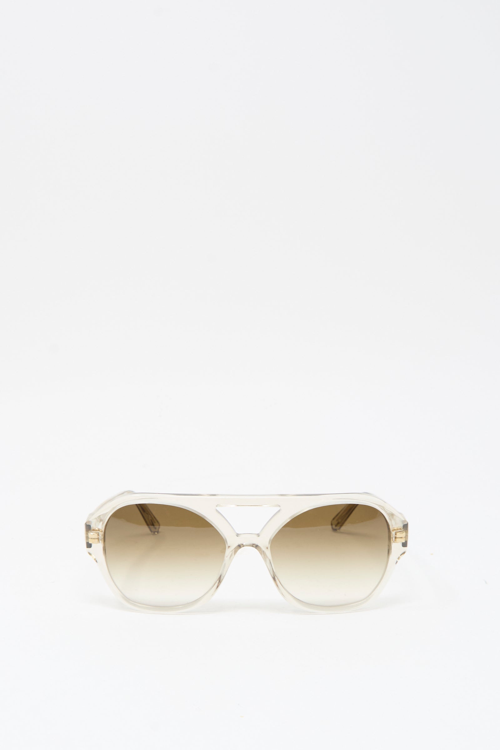 The Chiyo Aviator Sunglasses in Hinoki by Eva Masaki feature beige Italian acetate frames and gradient brown UV-protective lenses, shown on a plain white background.